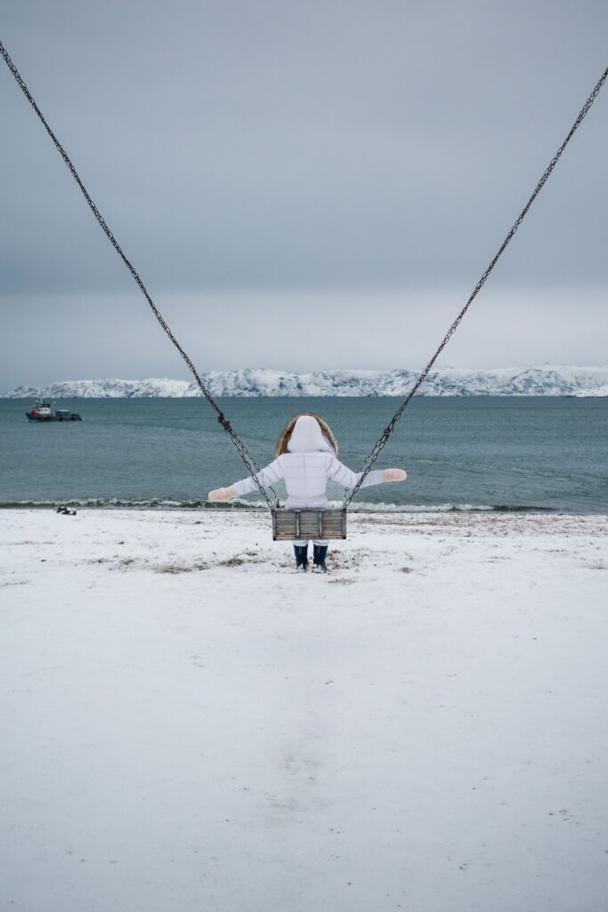 Seaside swing on the snowy Teriberka beach