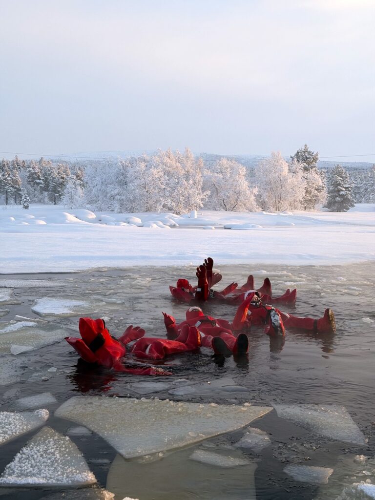 Ice-floating guests beside a snow-covered shoreline